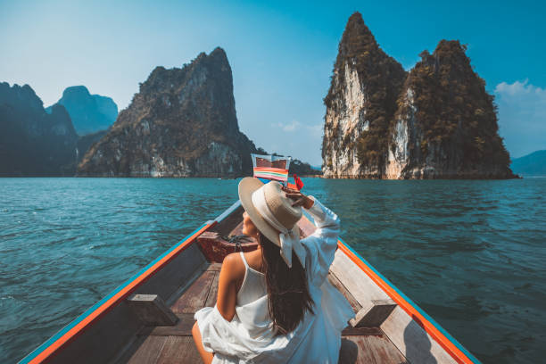 Longtail boat exploring limestone islands