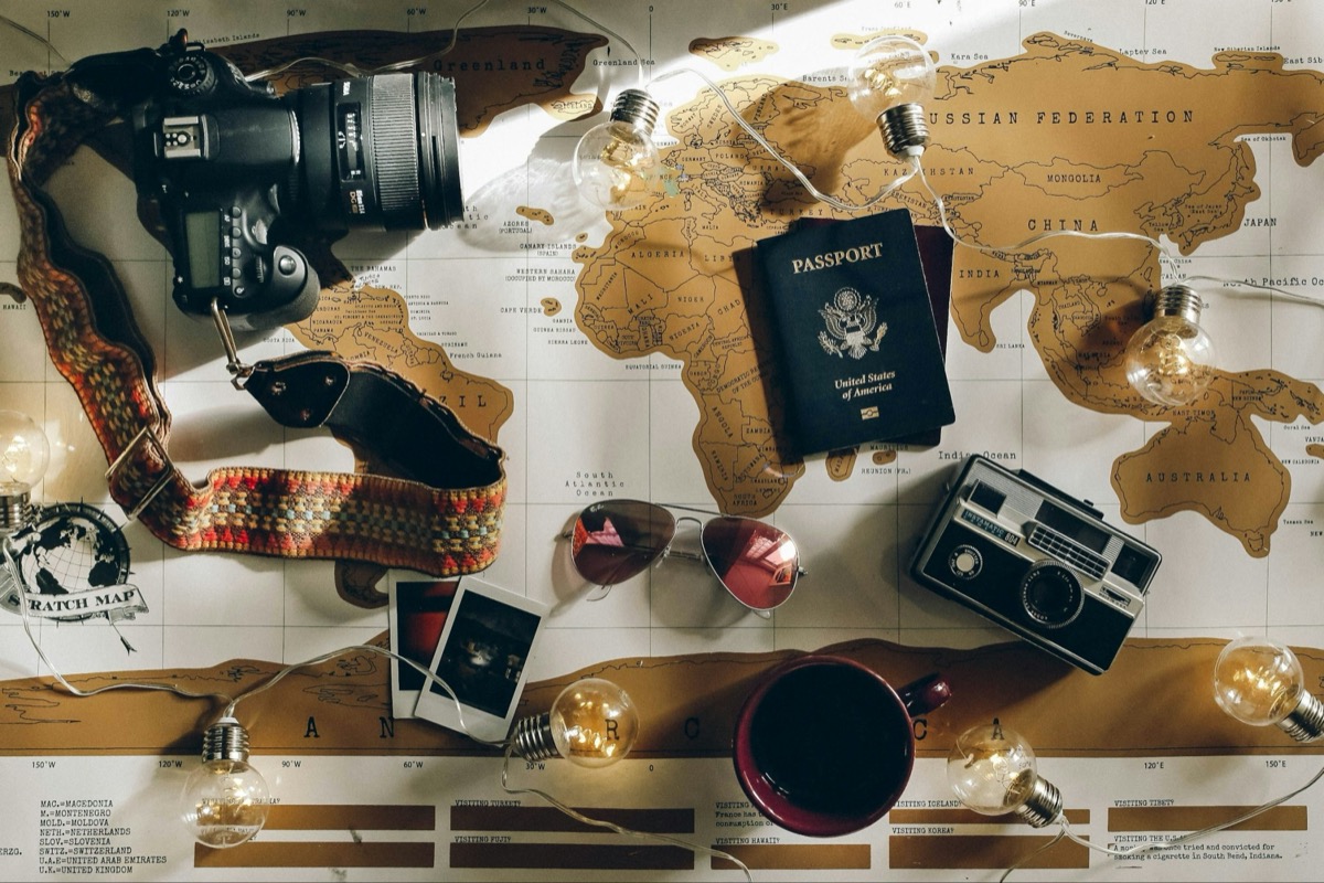 Passport, camera and travel map ready for the next trip
